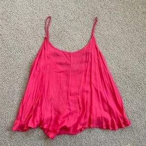 Cute pink free people tank! Flowy, and has fake ties in the back. Never worn.